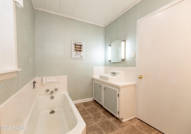 full bathroom featuring crown molding, tile patterned floors, vanity, and a bath