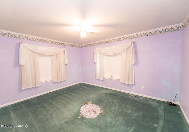 empty room with baseboards and dark colored carpet