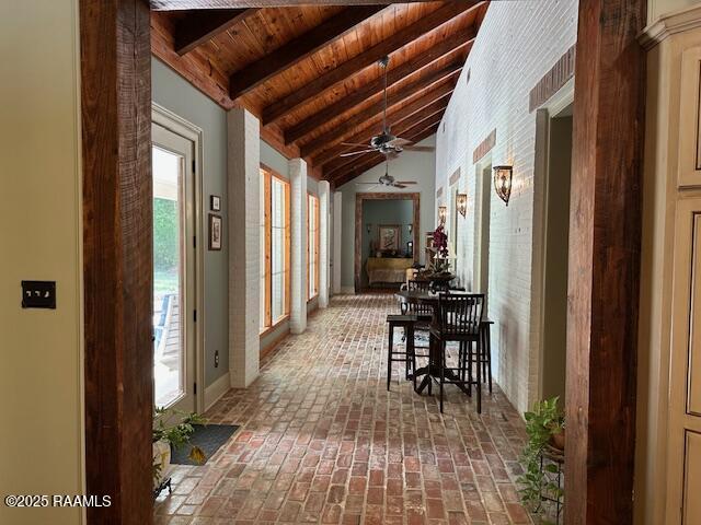 10427 U S Highway 167, Abbeville, LA 70510 - hall with lofted ceiling with beams, brick floor, and wooden ceiling