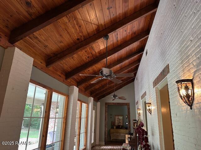 10427 U S Highway 167, Abbeville, LA 70510 - interior space with beamed ceiling, wooden ceiling, high vaulted ceiling, and brick wall