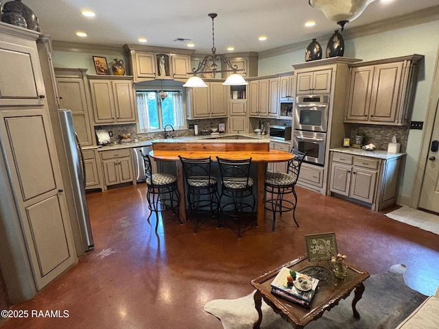 10427 U S Highway 167, Abbeville, LA 70510 - kitchen featuring a sink, backsplash, a kitchen bar, and stainless steel appliances