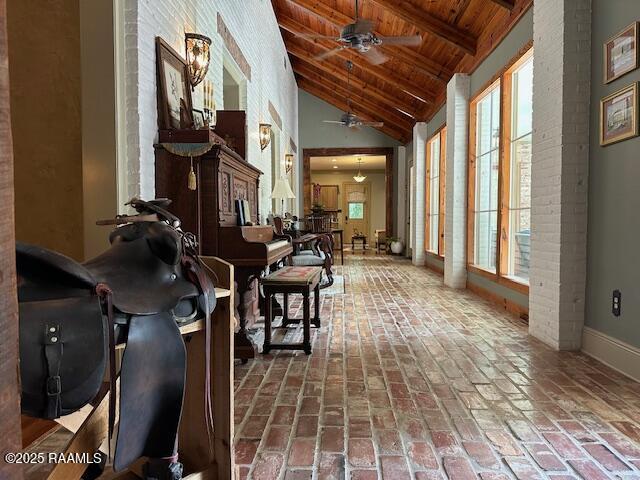 10427 U S Highway 167, Abbeville, LA 70510 - interior space with baseboards, brick floor, and wooden ceiling