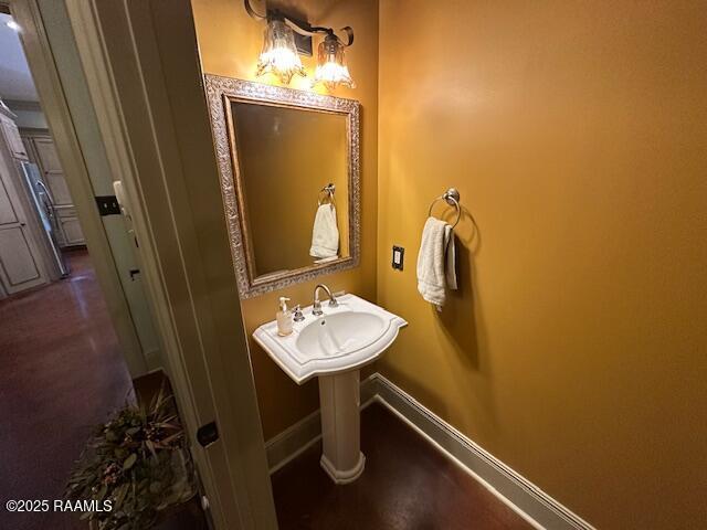 10427 U S Highway 167, Abbeville, LA 70510 - bathroom featuring baseboards
