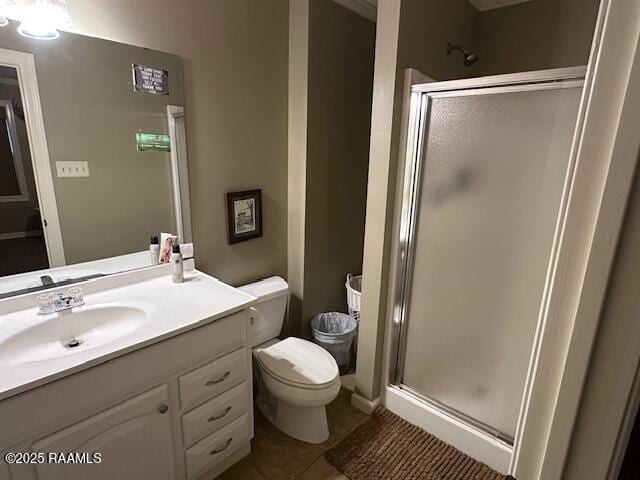 10427 U S Highway 167, Abbeville, LA 70510 - bathroom with vanity, toilet, tile patterned flooring, and a stall shower