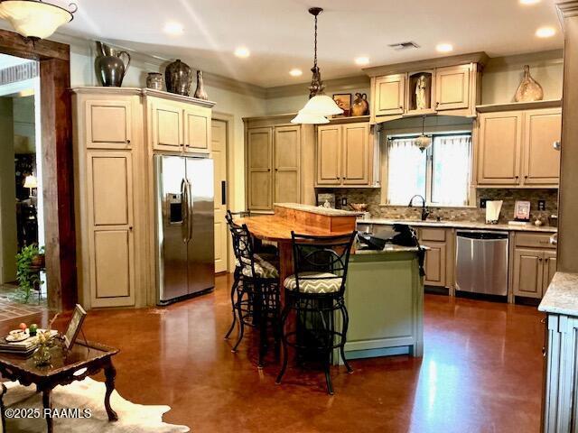 10427 U S Highway 167, Abbeville, LA 70510 - kitchen featuring a sink, appliances with stainless steel finishes, a kitchen island, and tasteful backsplash