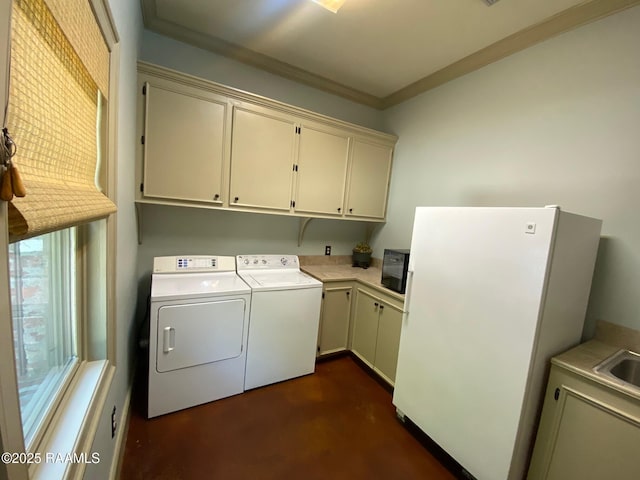10427 U S Highway 167, Abbeville, LA 70510 - clothes washing area with cabinet space, separate washer and dryer, ornamental molding, and a sink
