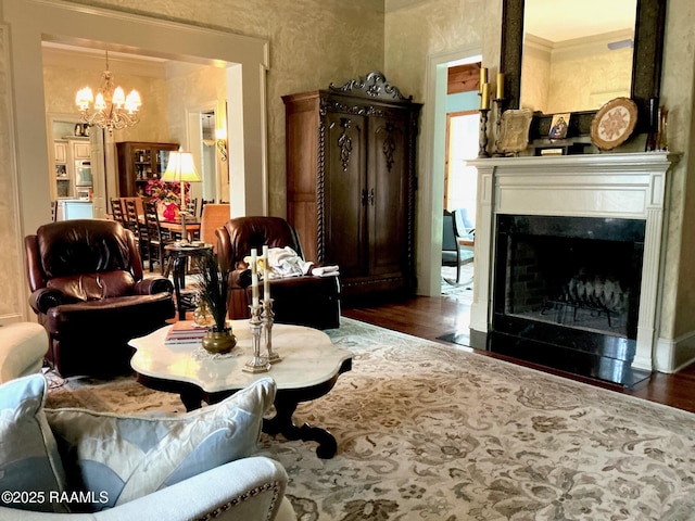 10427 U S Highway 167, Abbeville, LA 70510 - living area featuring a premium fireplace, an inviting chandelier, and wood finished floors