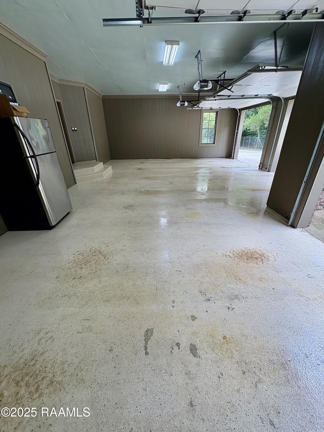 10427 U S Highway 167, Abbeville, LA 70510 - garage with freestanding refrigerator and a garage door opener