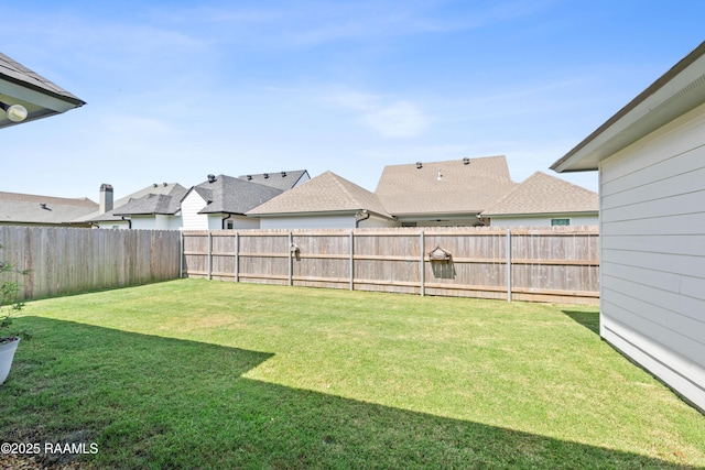 view of yard with a fenced backyard