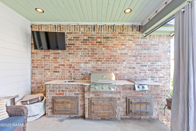view of patio / terrace with area for grilling and a sink
