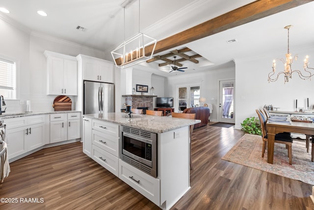 kitchen with ceiling fan with notable chandelier, dark wood-style floors, recessed lighting, appliances with stainless steel finishes, and backsplash