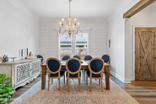 dining space with crown molding, a chandelier, wood walls, baseboards, and wood finished floors