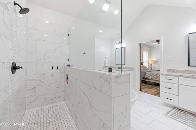 bathroom featuring visible vents, a tile shower, marble finish floor, ensuite bathroom, and lofted ceiling