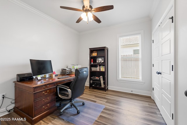 office space featuring crown molding, ceiling fan, baseboards, and wood finished floors