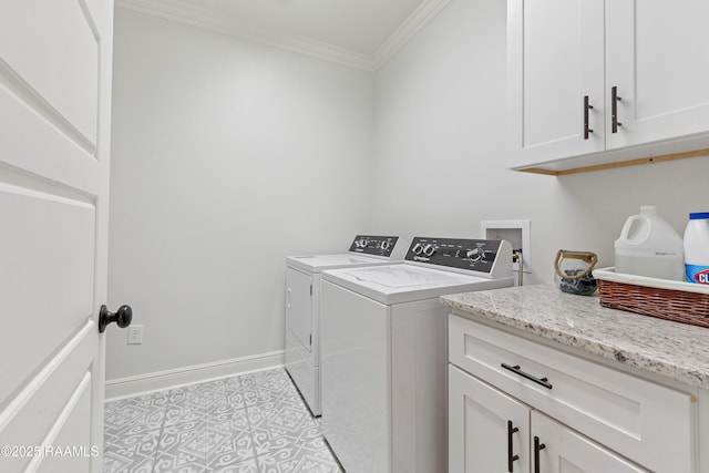 laundry area featuring cabinet space, light tile patterned flooring, separate washer and dryer, baseboards, and ornamental molding