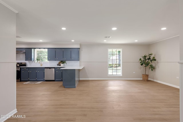 204 Tillou Andrus Dr, Opelousas, LA 70570 - kitchen with blue cabinetry, appliances with stainless steel finishes, plenty of natural light, and light wood-style flooring