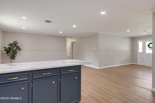 204 Tillou Andrus Dr, Opelousas, LA 70570 - kitchen with light wood-style floors, recessed lighting, visible vents, ornamental molding, and blue cabinets