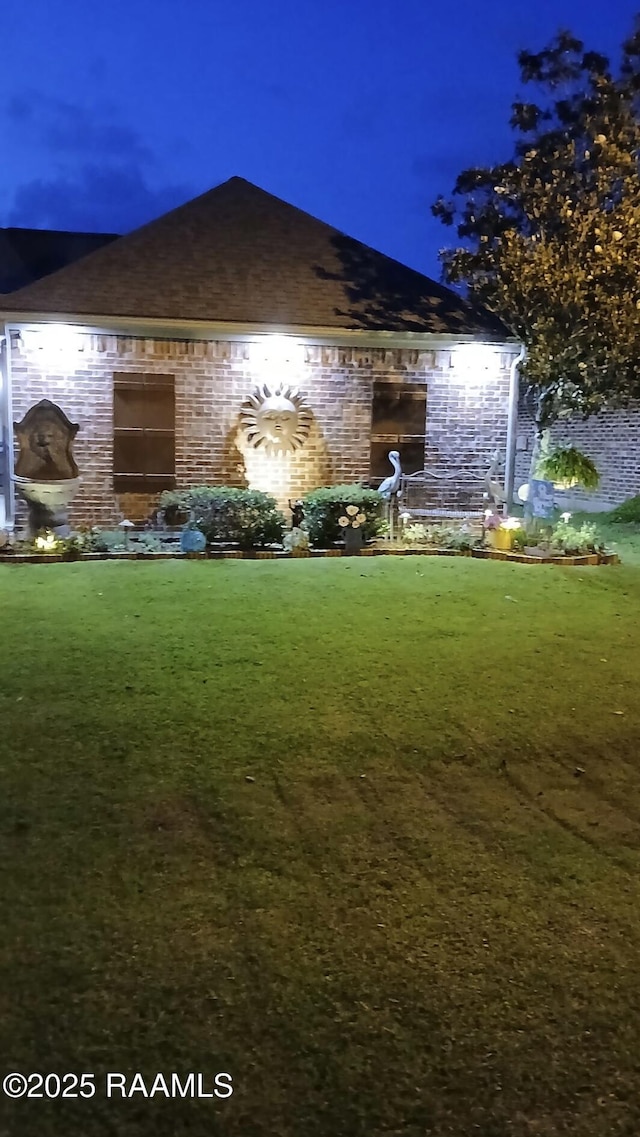 107 Octavia Dr, Scott, LA 70583 - yard at twilight with a lawn