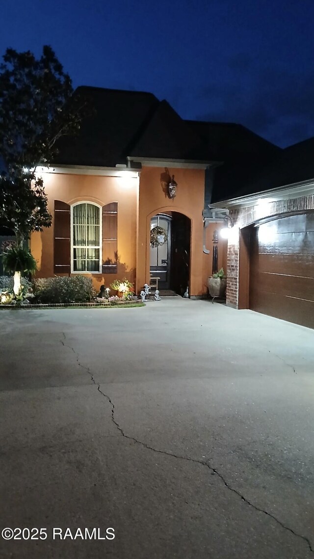107 Octavia Dr, Scott, LA 70583 - view of front of property featuring driveway and stucco siding