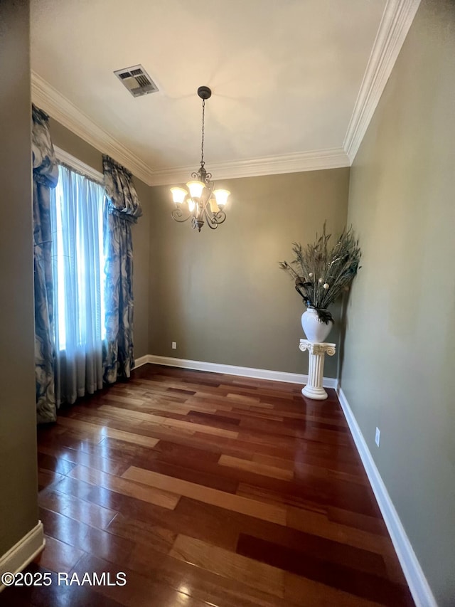 107 Octavia Dr, Scott, LA 70583 - spare room with a chandelier, crown molding, wood finished floors, and baseboards