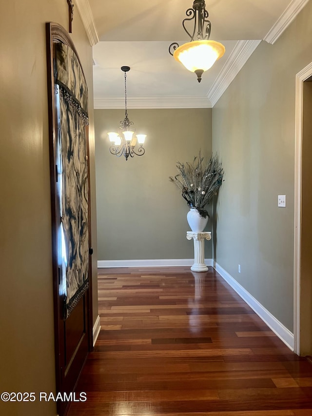 107 Octavia Dr, Scott, LA 70583 - foyer entrance with wood finished floors, ornamental molding, a chandelier, and baseboards