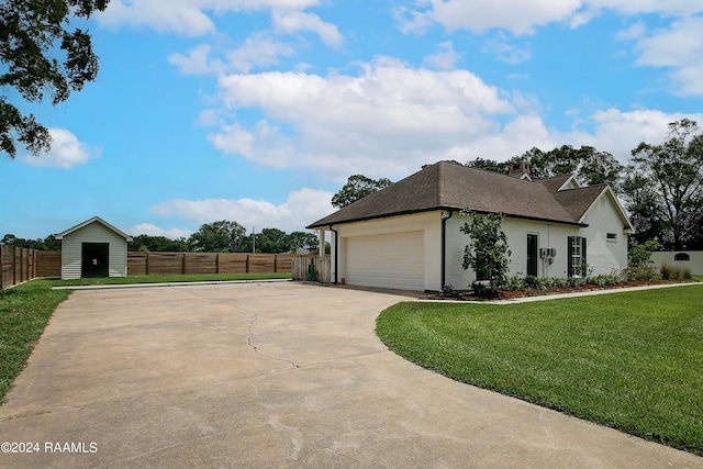 exterior space with driveway, a front yard, fence, brick siding, and a garage