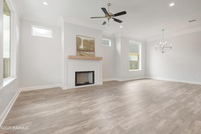 unfurnished living room with visible vents, ornamental molding, recessed lighting, and plenty of natural light