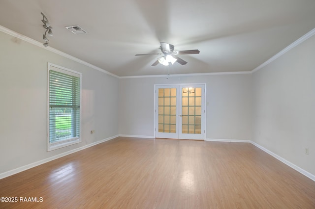 1621 Elm St, New Iberia, LA 70560 - spare room with crown molding, ceiling fan, light wood-style floors, baseboards, and visible vents