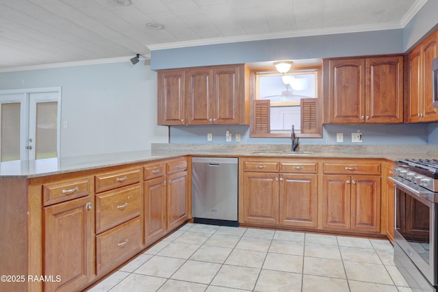 1621 Elm St, New Iberia, LA 70560 - kitchen with brown cabinets, light stone countertops, appliances with stainless steel finishes, a sink, and a peninsula