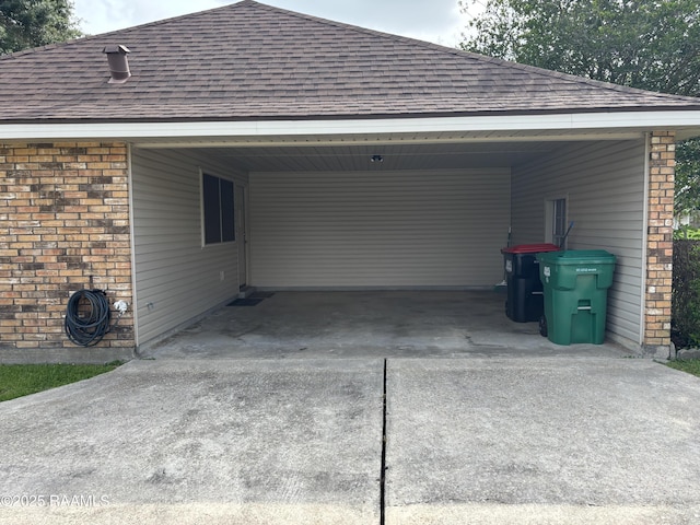 exterior space with a carport and concrete driveway