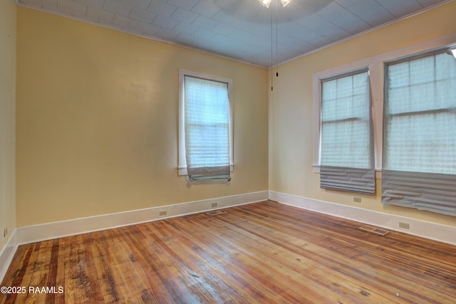 627 Weeks St, New Iberia, LA 70560 - empty room with hardwood / wood-style flooring, baseboards, and ornamental molding