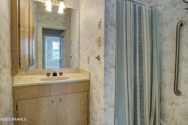 627 Weeks St, New Iberia, LA 70560 - bathroom featuring vanity, a shower with shower curtain, and wallpapered walls