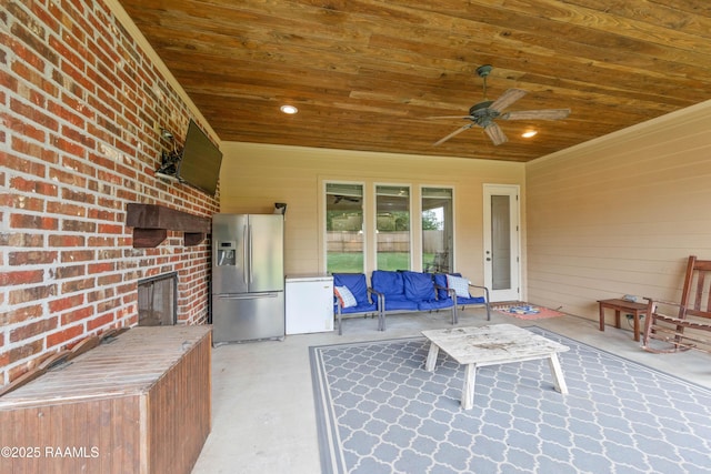 view of patio featuring ceiling fan and an outdoor kitchen