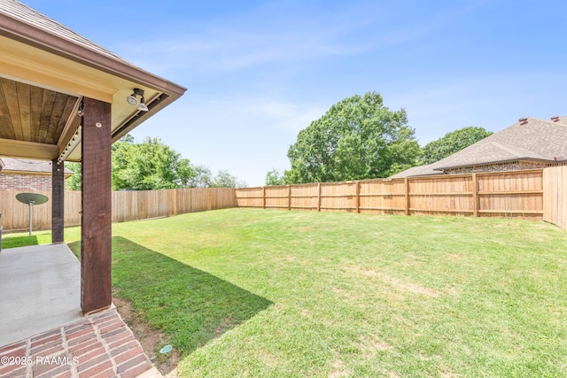 view of yard featuring a patio and a fenced backyard