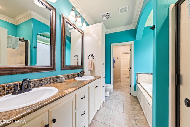 bathroom featuring visible vents, ornamental molding, and a sink