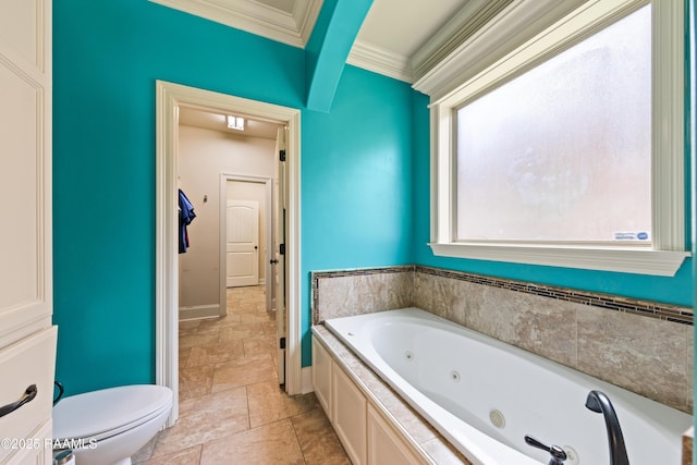bathroom with a jetted tub, stone finish floor, baseboards, toilet, and ornamental molding