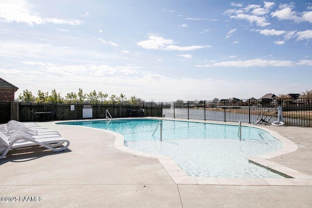 pool featuring a patio area and fence