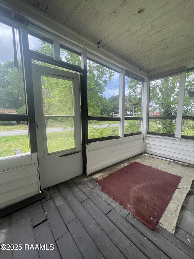 unfurnished sunroom featuring plenty of natural light