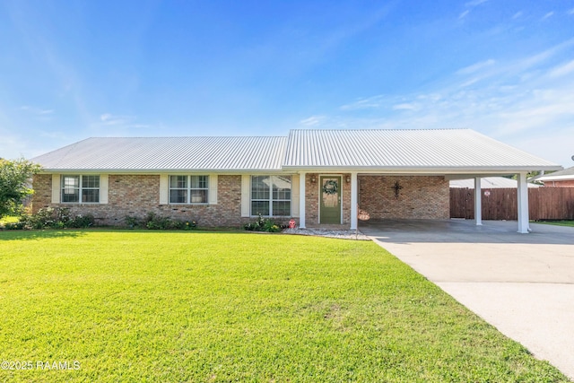 492 Kent St, Breaux Bridge, LA 70517 - ranch-style home featuring concrete driveway, brick siding, and an attached carport