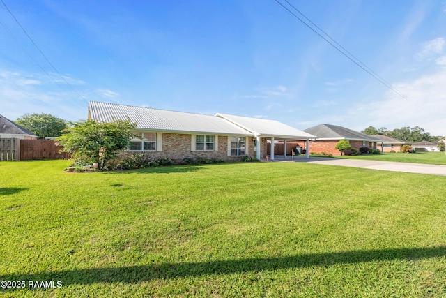 492 Kent St, Breaux Bridge, LA 70517 - single story home featuring driveway, a carport, metal roof, and brick siding