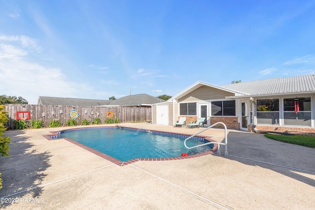 492 Kent St, Breaux Bridge, LA 70517 - view of swimming pool with a patio area, a fenced backyard, and a sunroom