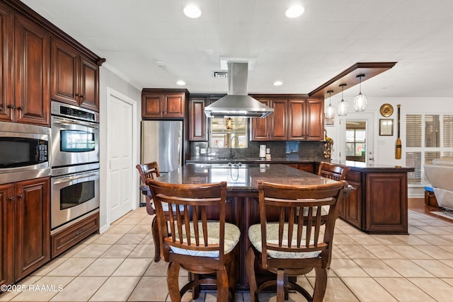 492 Kent St, Breaux Bridge, LA 70517 - kitchen featuring appliances with stainless steel finishes, decorative backsplash, light tile patterned floors, crown molding, and a kitchen island