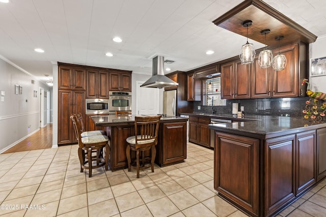 492 Kent St, Breaux Bridge, LA 70517 - kitchen with island range hood, appliances with stainless steel finishes, ornamental molding, light tile patterned floors, and recessed lighting
