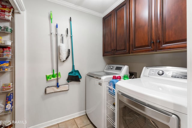 492 Kent St, Breaux Bridge, LA 70517 - laundry area featuring washer and dryer, cabinet space, ornamental molding, baseboards, and light tile patterned floors
