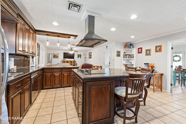 492 Kent St, Breaux Bridge, LA 70517 - kitchen with island range hood, light tile patterned floors, a breakfast bar area, black electric cooktop, and healthy amount of natural light
