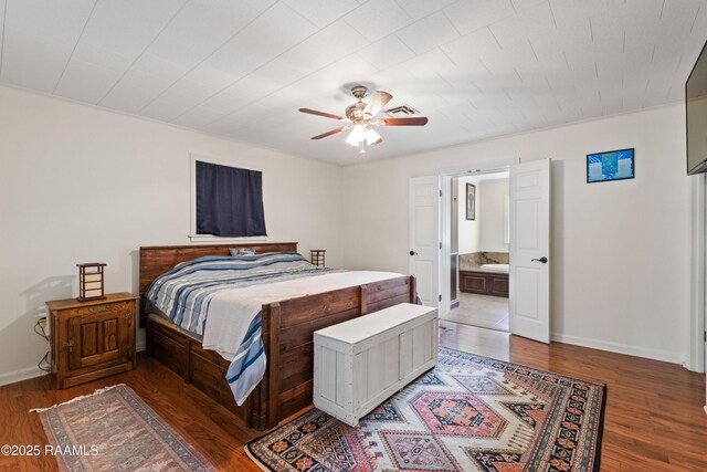 492 Kent St, Breaux Bridge, LA 70517 - bedroom with wood finished floors, baseboards, a ceiling fan, and ensuite bathroom