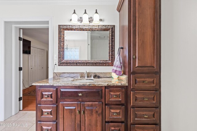 492 Kent St, Breaux Bridge, LA 70517 - bathroom featuring tile patterned flooring, vanity, and ornamental molding