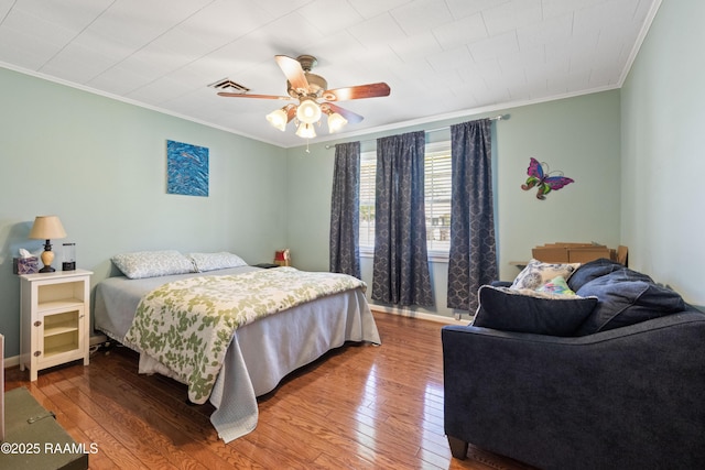 492 Kent St, Breaux Bridge, LA 70517 - bedroom featuring ornamental molding, hardwood / wood-style floors, a ceiling fan, and baseboards