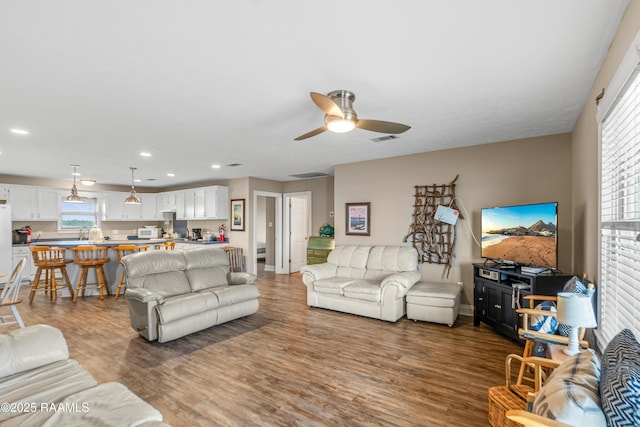 4998 Airhart Rd Unit A, Lake Charles, LA 70605 - living area with ceiling fan, visible vents, wood finished floors, baseboards, and recessed lighting