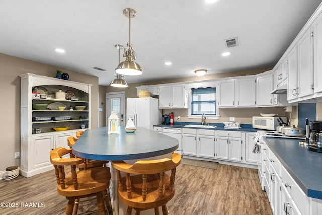 4998 Airhart Rd Unit A, Lake Charles, LA 70605 - kitchen featuring a sink, dark countertops, white appliances, and visible vents